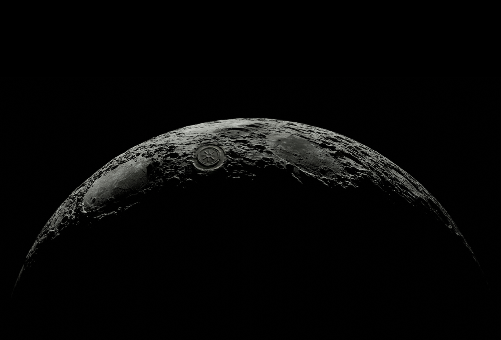 Close-up of a lunar surface with craters on a black background ECOMVAULT